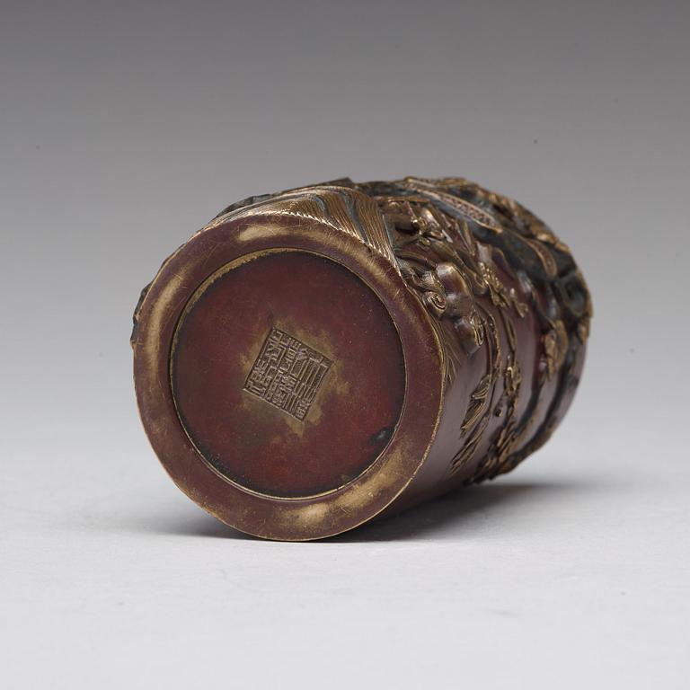 A bronze brush pot, Qing dynasty, with Qianlong seal mark to base.