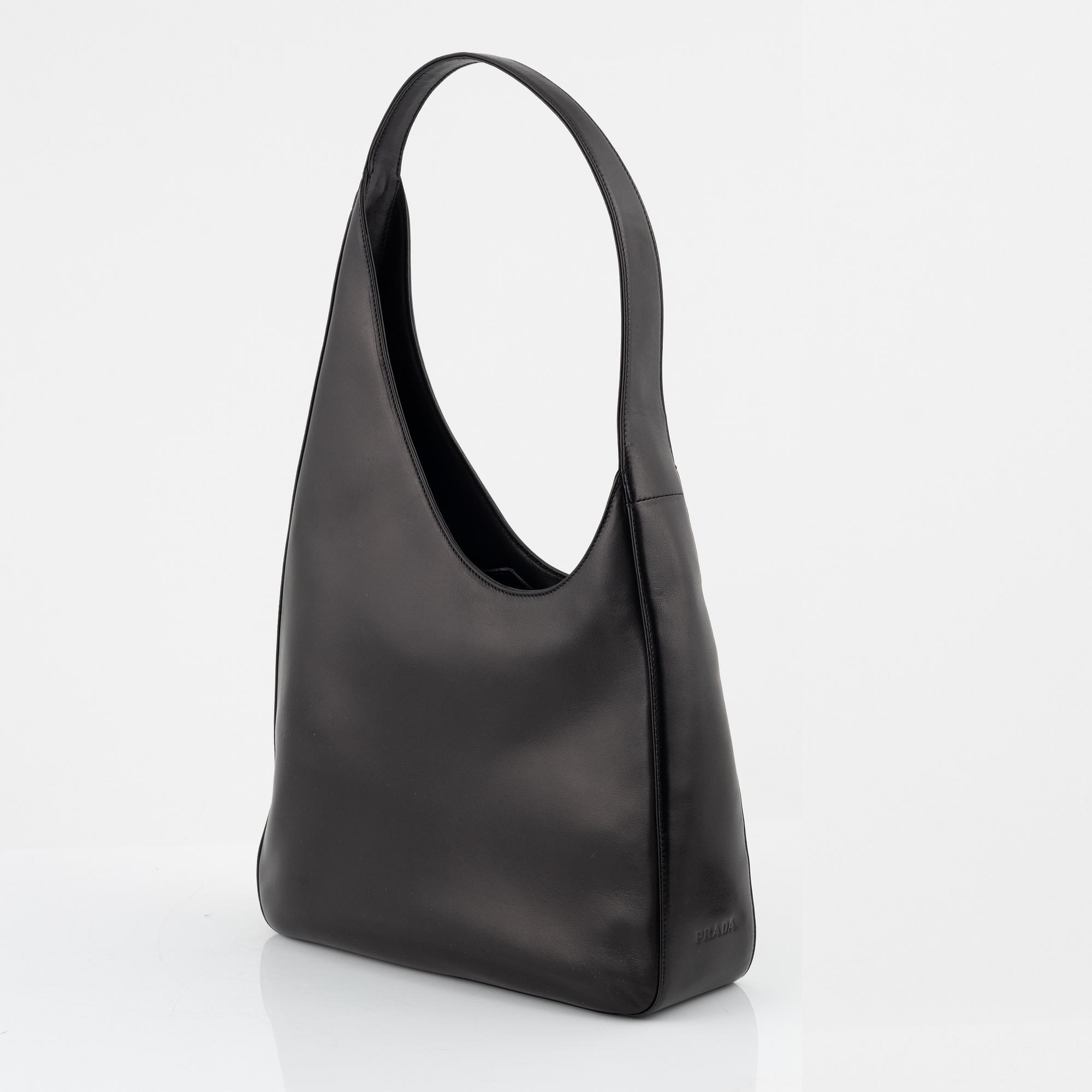 Prada, a black leather bag.
