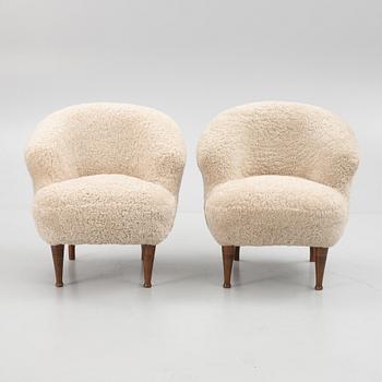 A pair of Swedish Modern armchairs, mid 20th century.