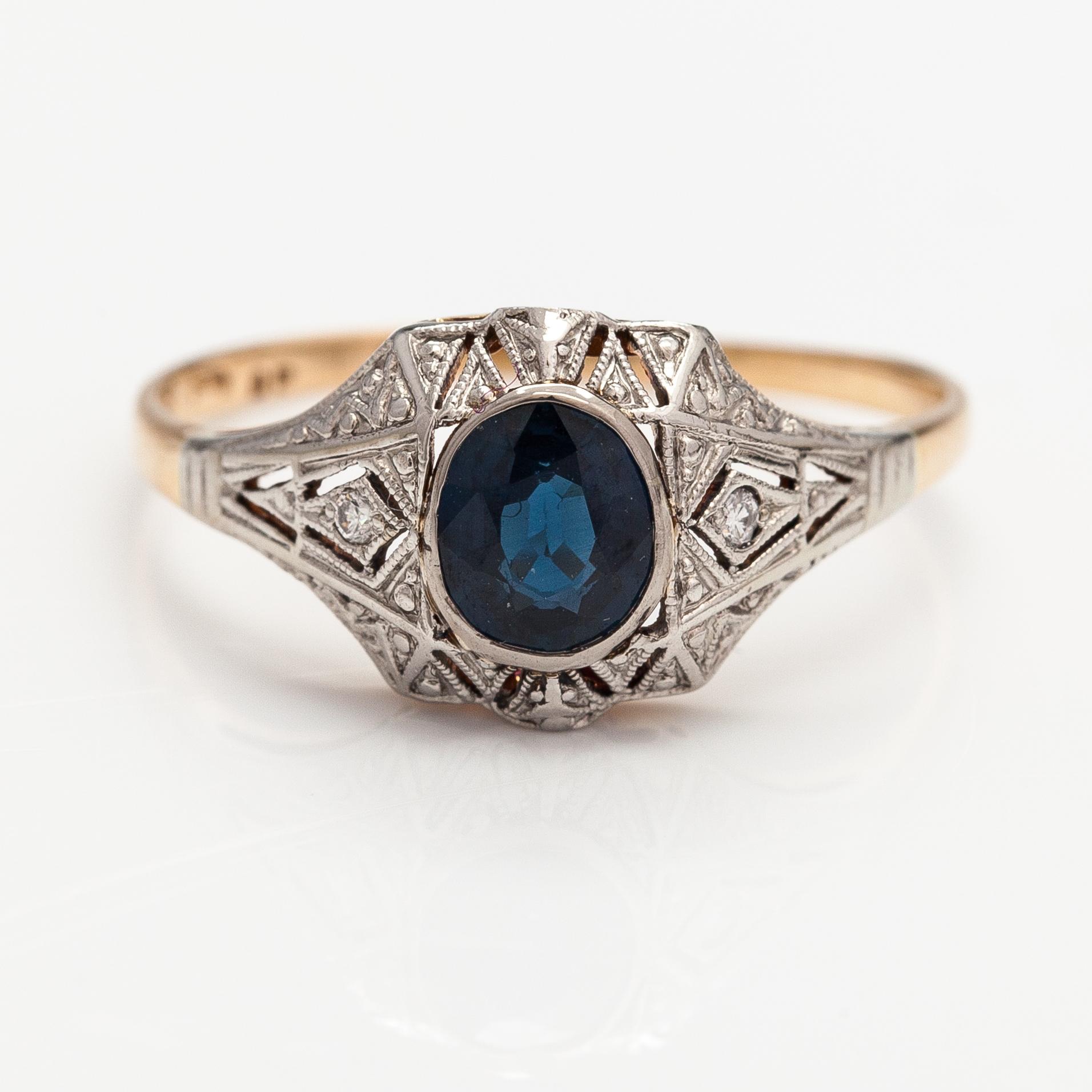 A 14K gold ring with diamonds ca. 0.02 ct in total and a sapphire. Finnish import marks.