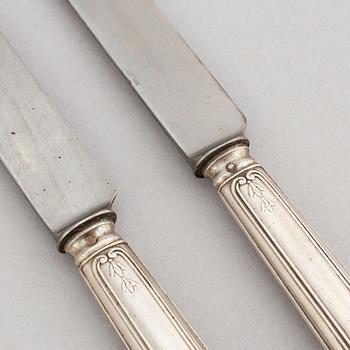 A set of twelve French silver knives, 19th century.