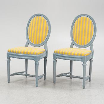 A painted sofa, table, a pair of chairs, a pair of armchairs, a pair of stools, Gustavian style, 20th Century.
