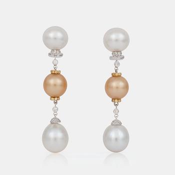 652. A pair of white and yellow cultured pearl earrings.