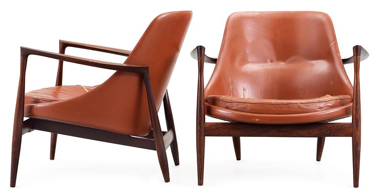 A pair of Ib Kofod Larsen 'Elisabeth' palisander and brown leather easy chairs.