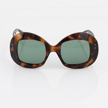 Oliver Goldsmith, a pair of "Uuksu" sunglasses.