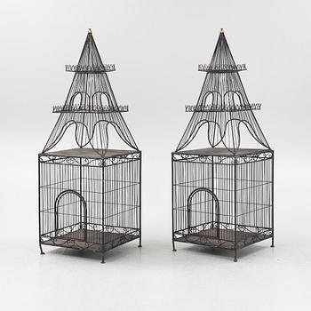 A pair of metal plant cages, contemporary.