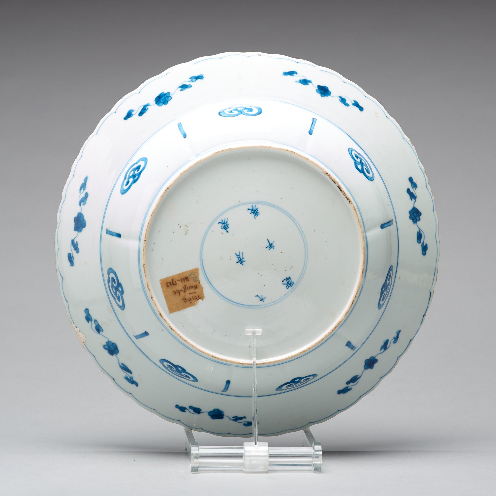 A large blue and white deep dish, Qing dynasty, with Kangxi six character mark and period (1662-1722).