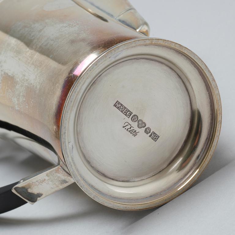 A silver coffee pot, sugar bowl and creamer by Thore Eldh for K&EC in Göteborg, 1949.
