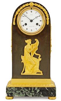 424. A French Empire mantel clock by A. A. Ravrio.