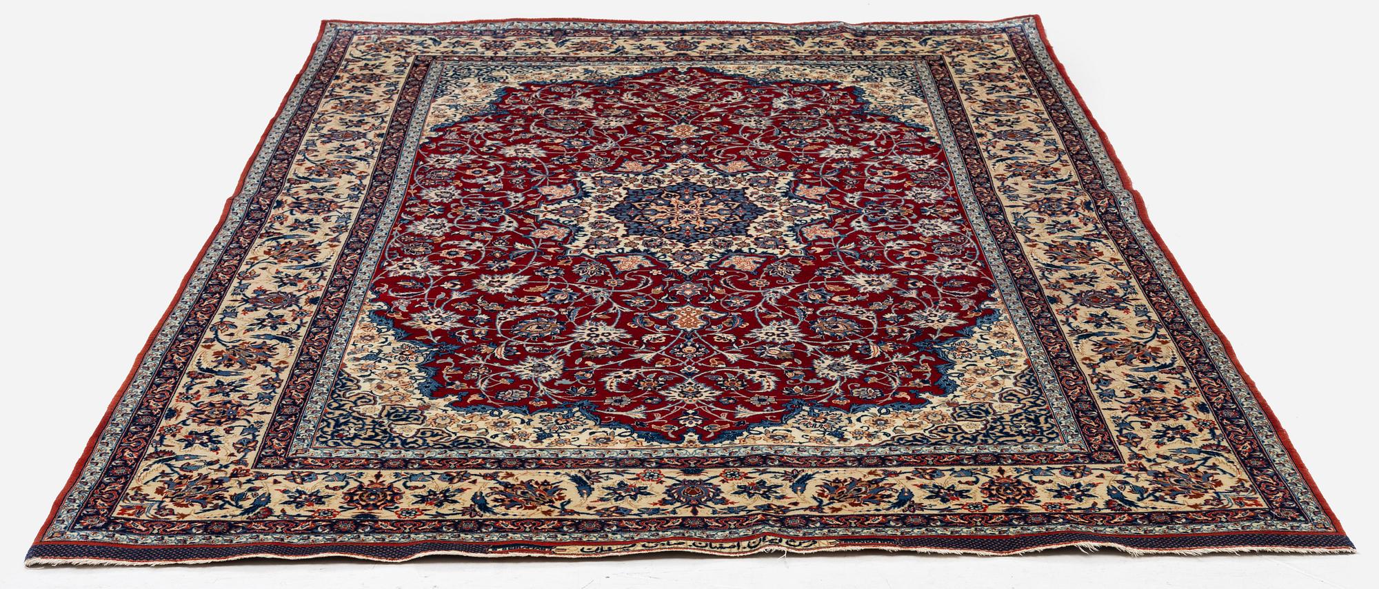 A semi-antique Isfahan rug, Central Persia, signed (Sadegh) Seirafian, c. 237 x 146 cm.