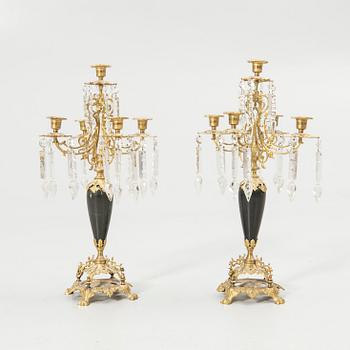 Pair of candelabra and a firedog, 18th/19th century.
