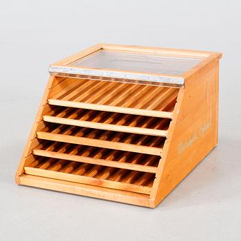 A wooden box with glass for spools of thread, mid 20th century.