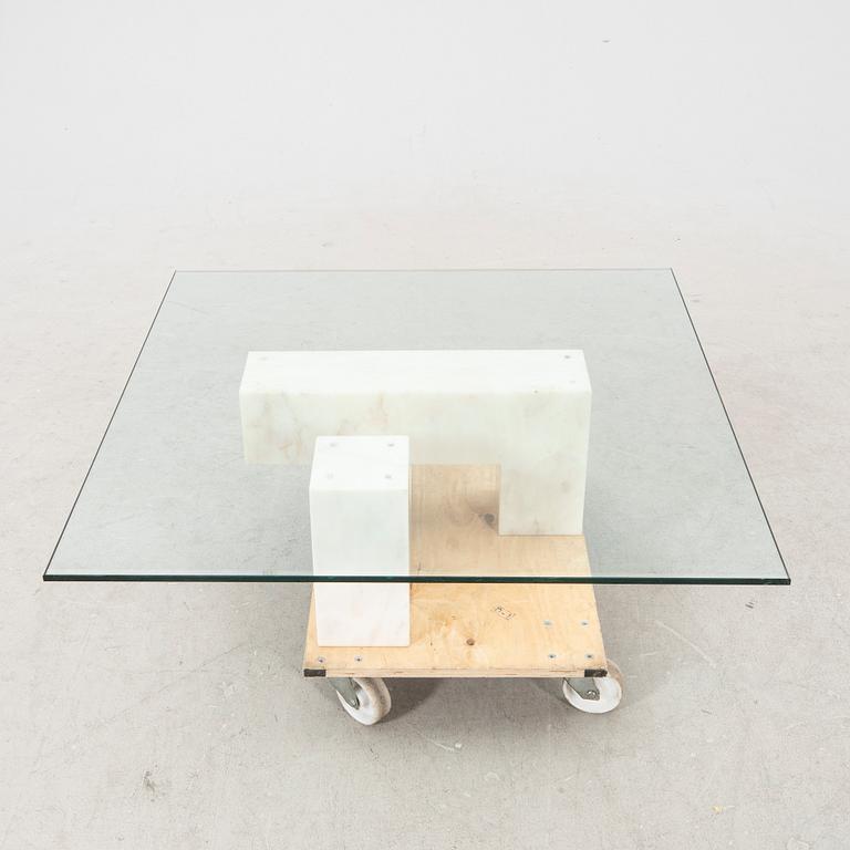A late 20th century/21st century marble and glass coffee table.