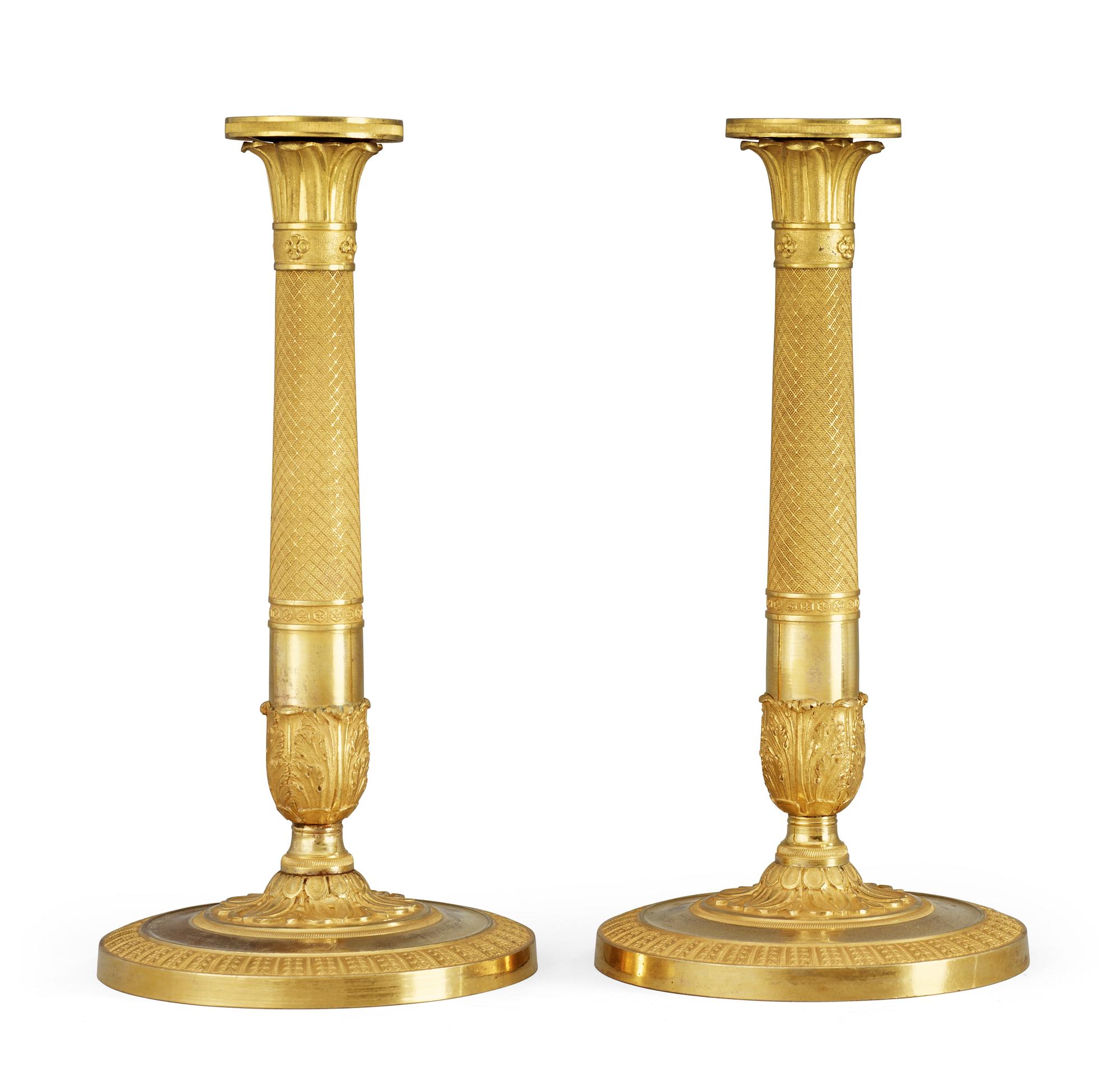 A pair of French Empire early 19th Century candlesticks.