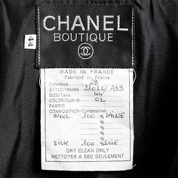 CHANEL, a two-piece suit consisting of jacket and skirt.