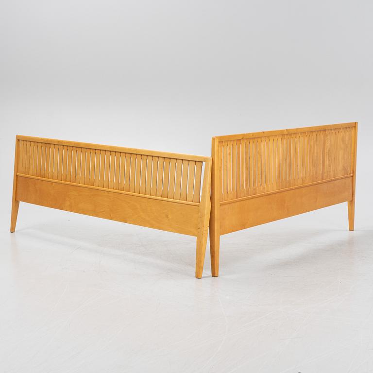 An 'Ulrika' birch headboard and foot end, by Carl Malmsten for Åfors, second half of the 20th Century.
