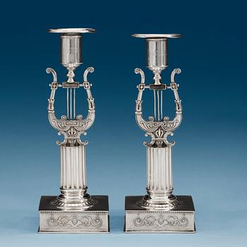 1019. A pair of Swedish 19th century silver candlesticks, makers mark of Johan Petter Grönvall, Stockholm 1823.