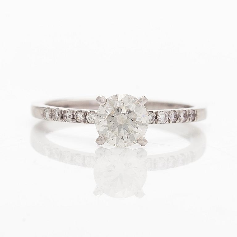 A 14K white gold ring with brilliant-cut diamonds.