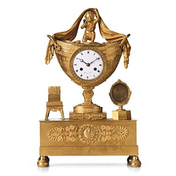 157. A French Empire early 19th century mantel clock.