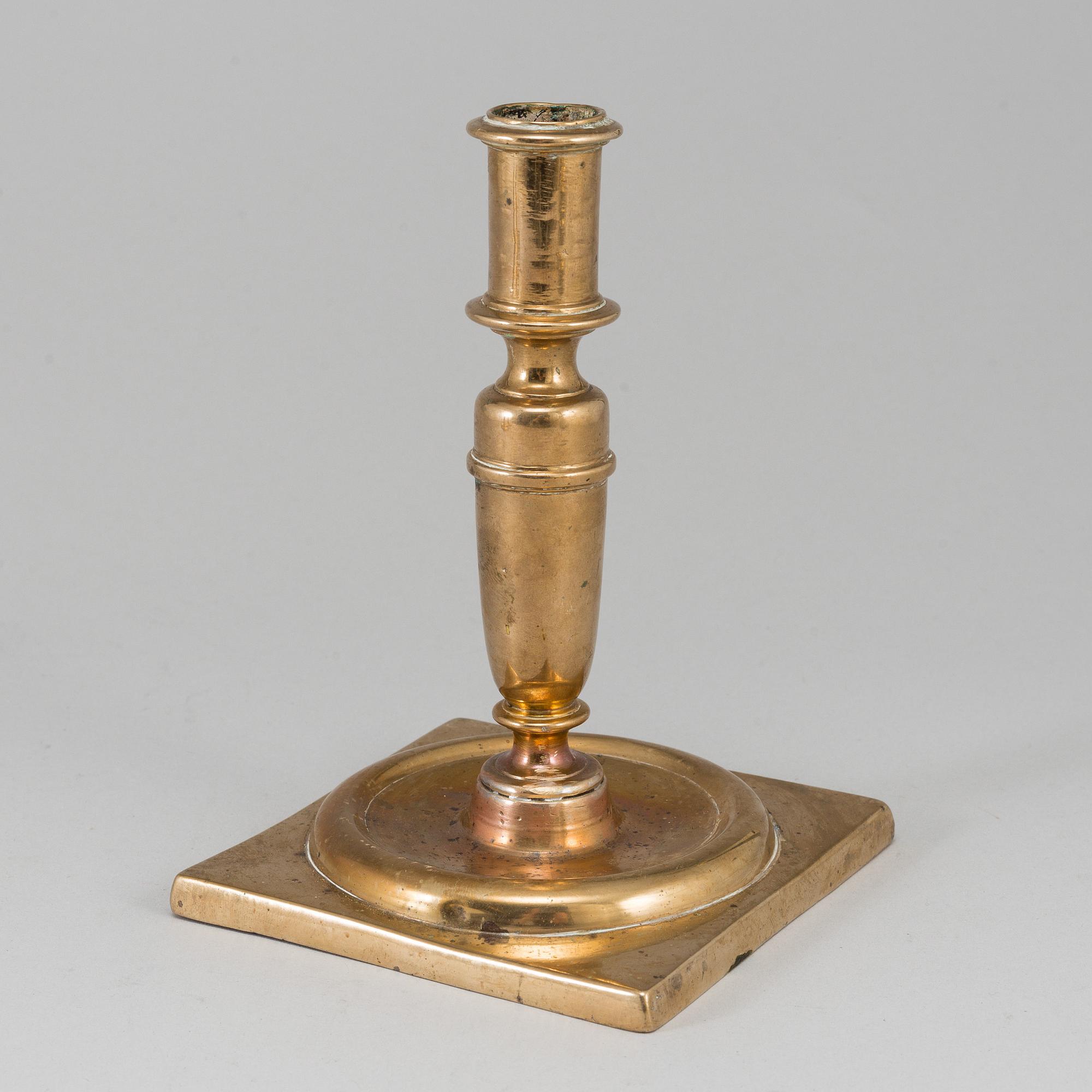A 17th century bronze candlestick.
