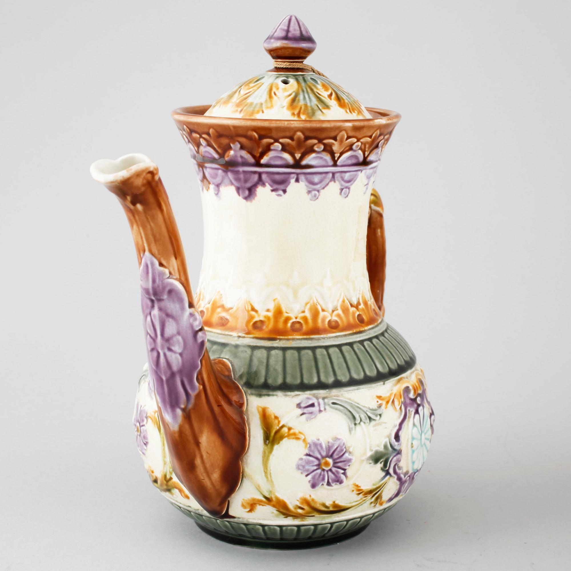A majolica collection of one coffee pot and three tea pots from Rörstrand, around turn of the century 1900.