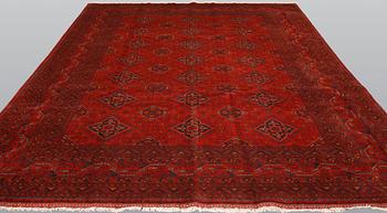 An Afghan carpet, 343 x 243 cm.