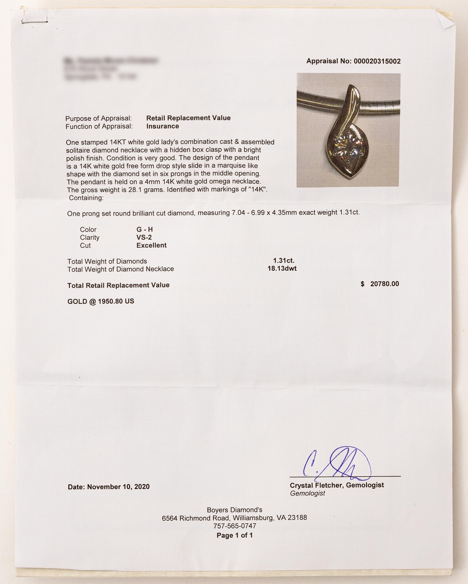 14K white gold solitaire diamond pendant.