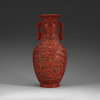 A lacquer vase, late Qing Dynasty (1644-1912) with Qianlong mark.