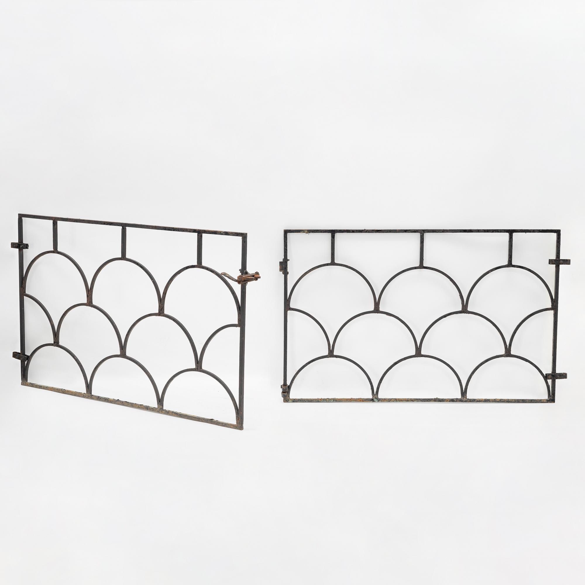 A pair of cast iron gates, 1930's.