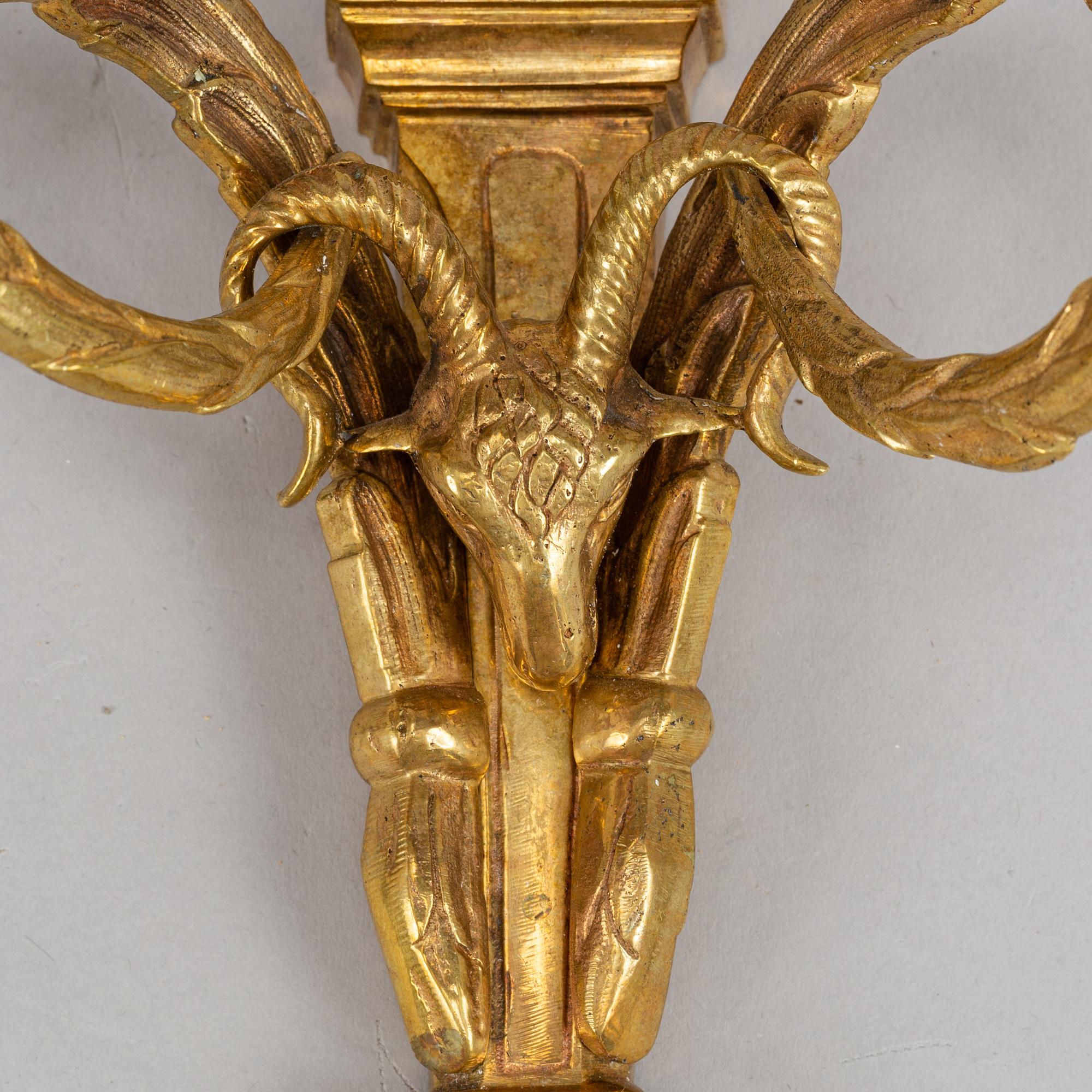 A pair of wall sconces, Louis XVI style, early 20th century.