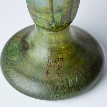 Daum, an Art Nouveau enamel painted cameo glass landscape vase.