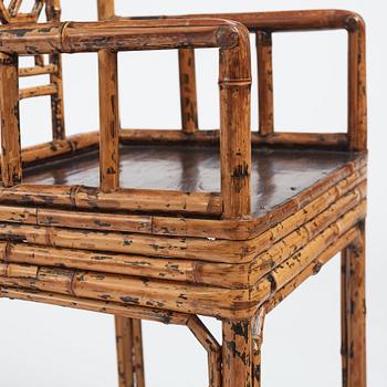 A pair of spotted bamboo chairs and a table, Qing dynasty, 19th Century.