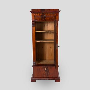A mahogany veneered cabinet from around year 1900.
