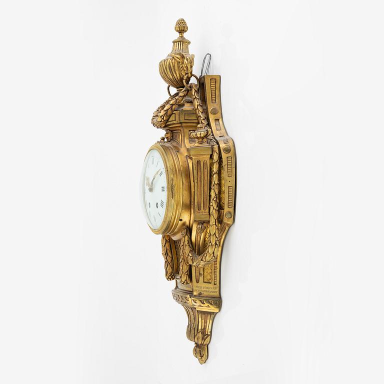 A Louis XVI-style wall clock, early 20th century.