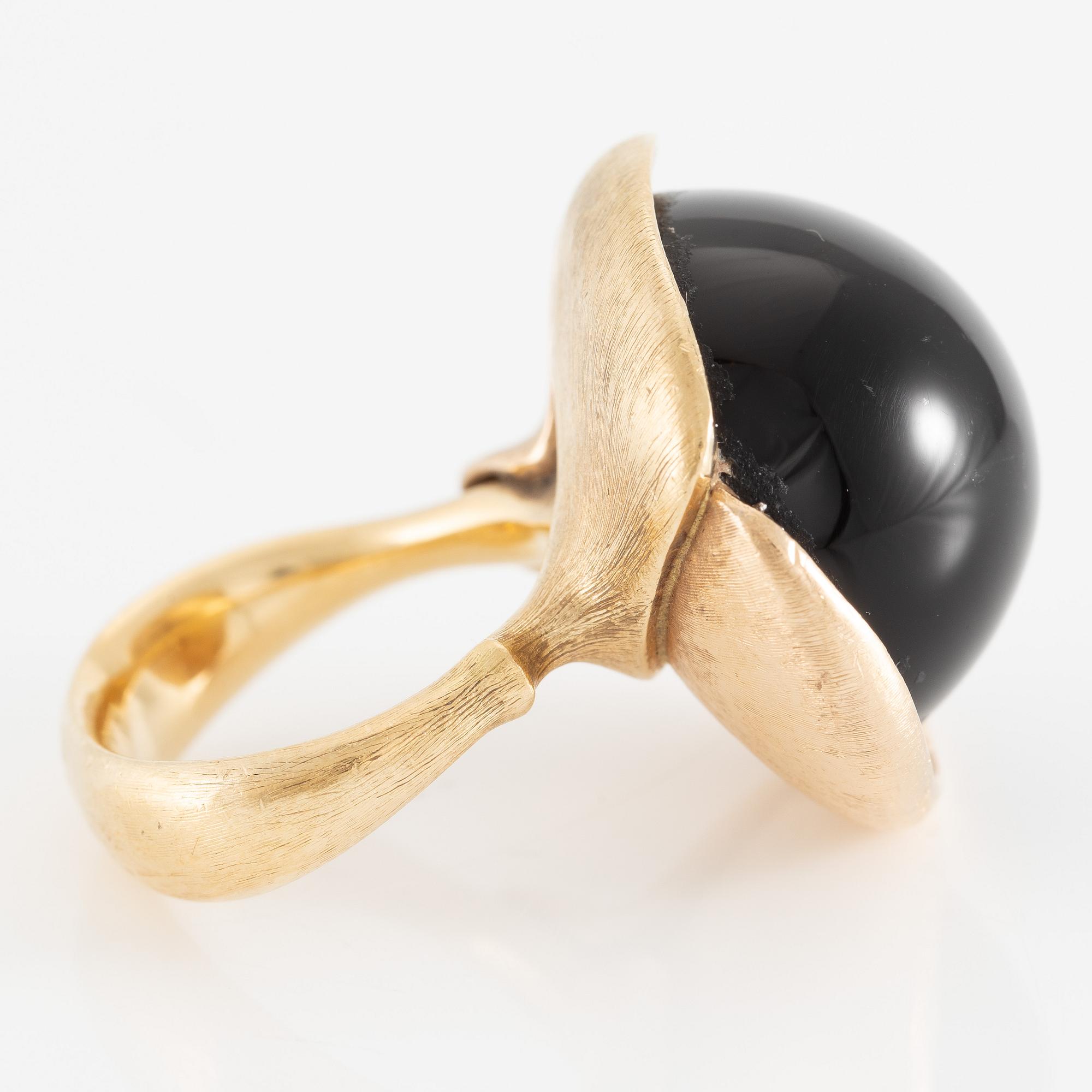 Ole Lynggaard, ring, large Lotus, 18K gold with cabochon-cut black stone probably onyx with brilliant-cut diamonds.