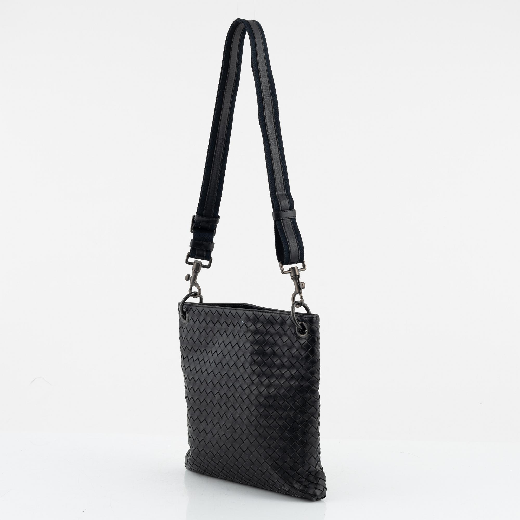 Bottega Veneta, a black intrecciato leather bag.