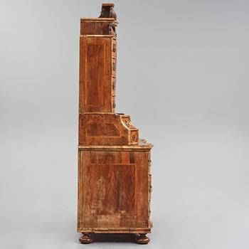 A South German late Baroque walnut and burr-walnut writing cabinet, first part of the 18th century.