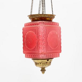 An art noveau glass and brass ceiling lamp from around the year 1900.