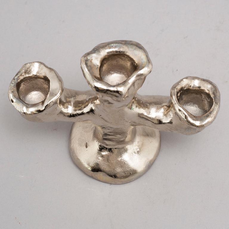 DAN WOLGERS, a silvergilt bronze candle stick, signed.