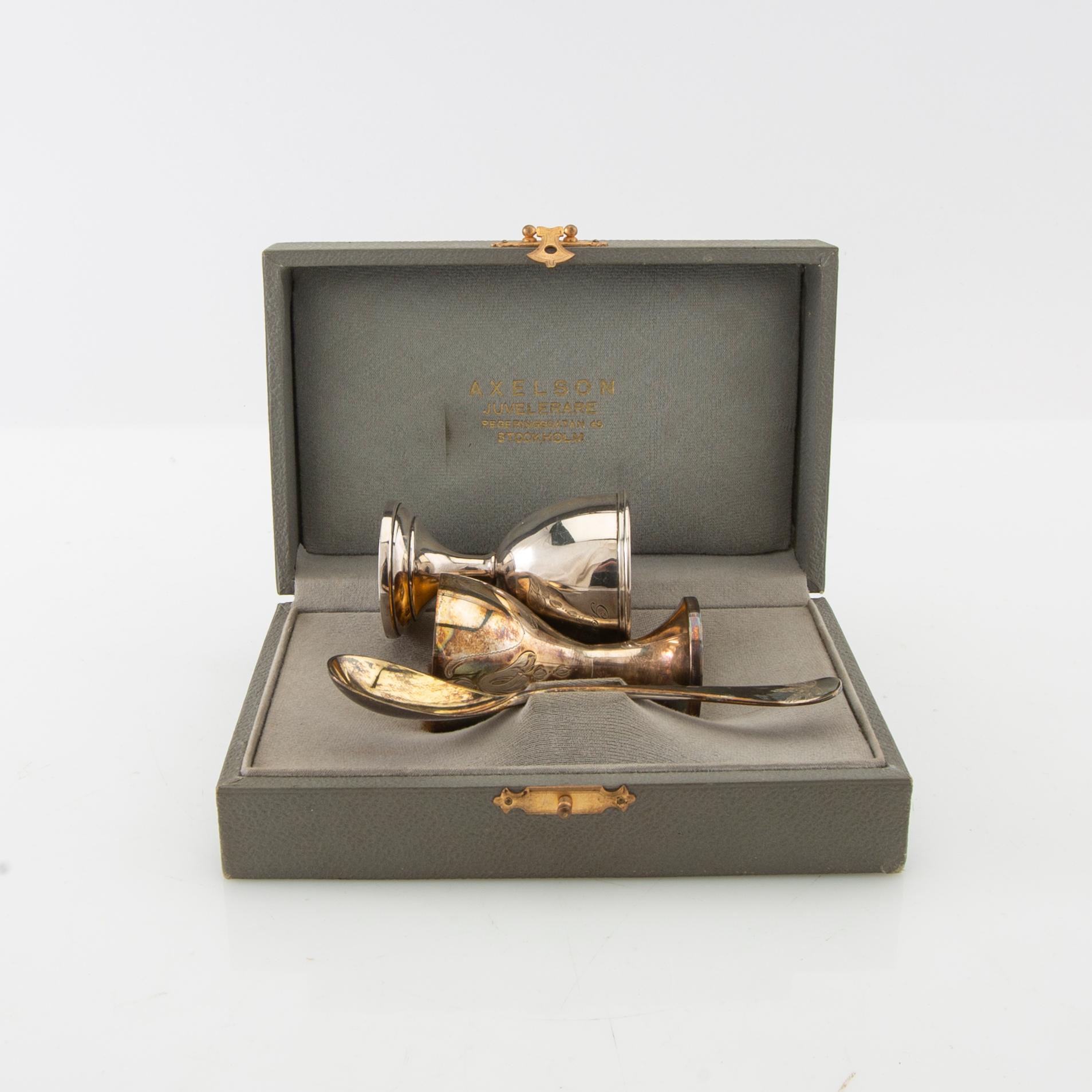 Egg cup with spoon and odd egg cup silver Swedish import marks.