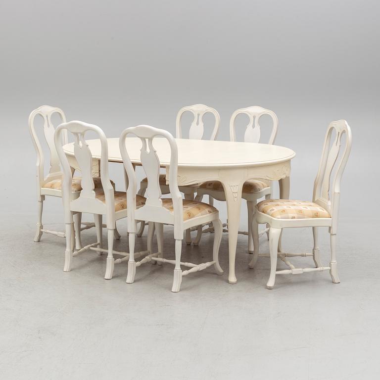 A Rococo style dining table and six chair, late 20th Century.