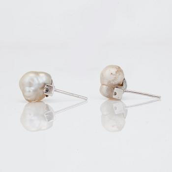 A pair of baroque natural saltwater pearl earrings with diamonds. Certificate from GCS.