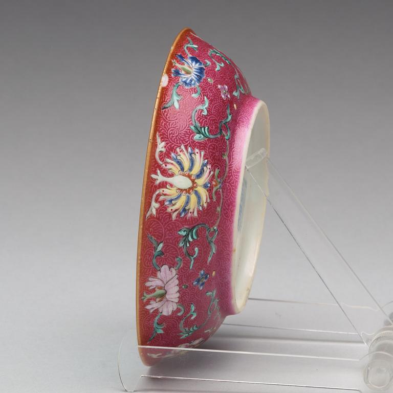 A turqoise ground and pink sgrafitto dish, Qing dynasty with Qianlong mark.