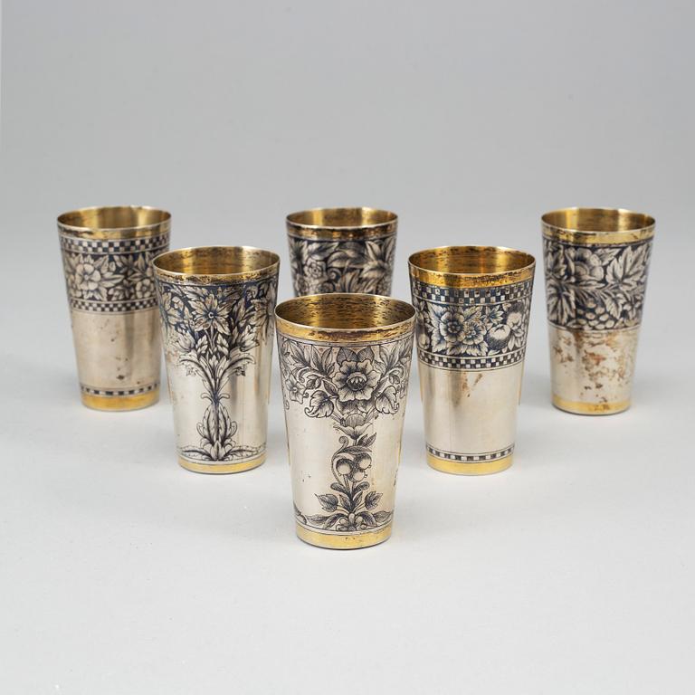 A Russian set of 6 parcel-gilt silver and niello vodka-cups, the Soviet Union/Russia, second half of the 20th century.