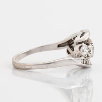 Platinum, brilliant and baguette cut diamond ring.