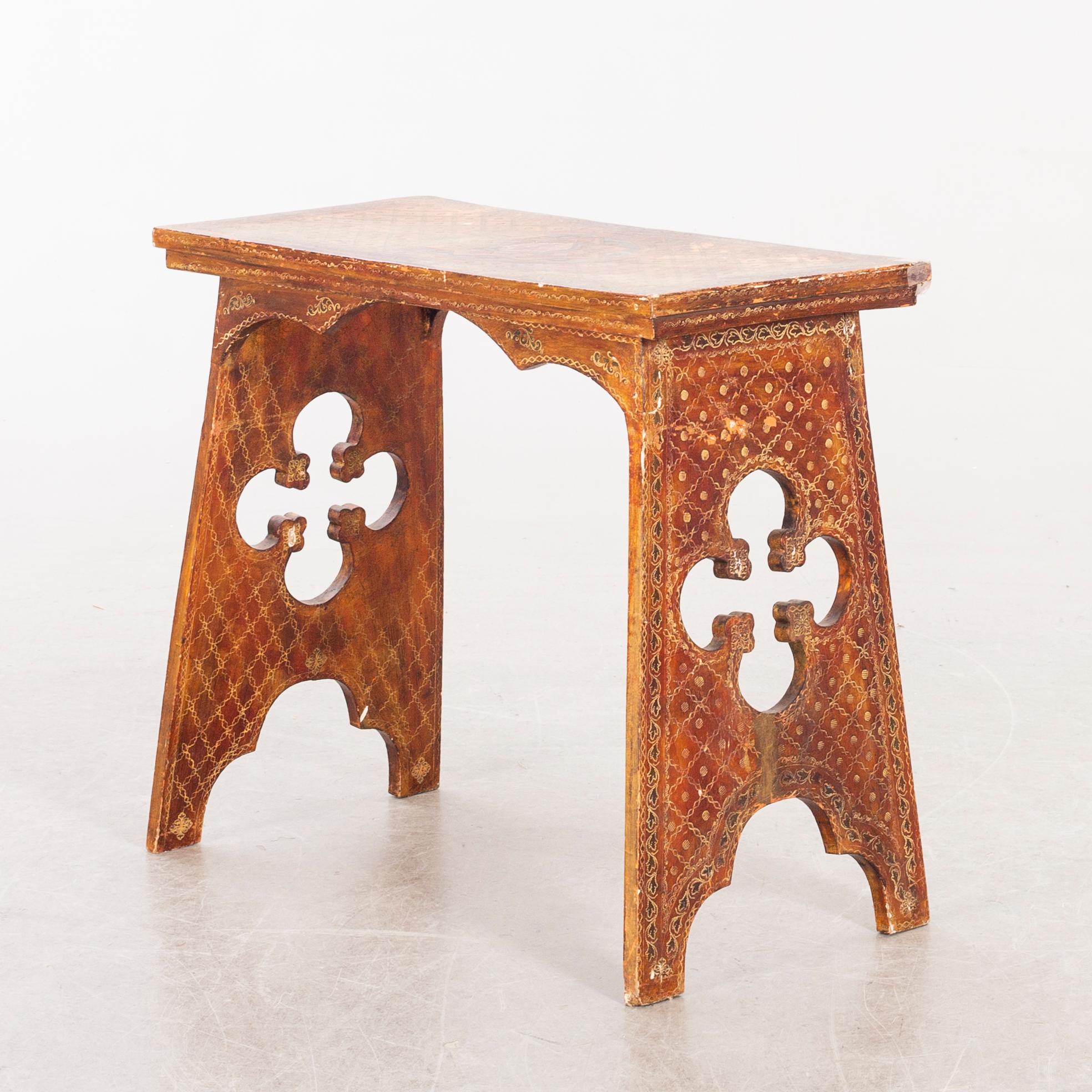 An mid 20th century wood table from Paoletti, Firenze Italy.