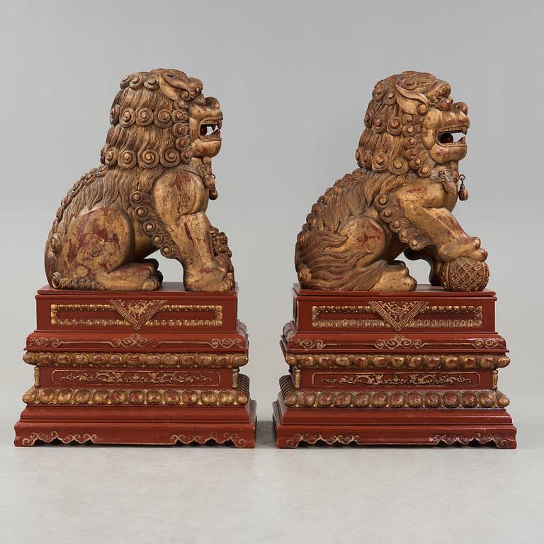 A pair of Chinese massive lacquered Buddhist lions, first half of the 20th Century.