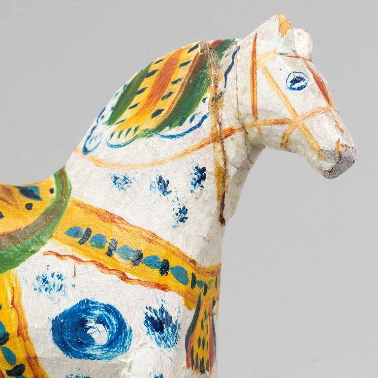 A painted Swedish wooden horse from the early 20th century.