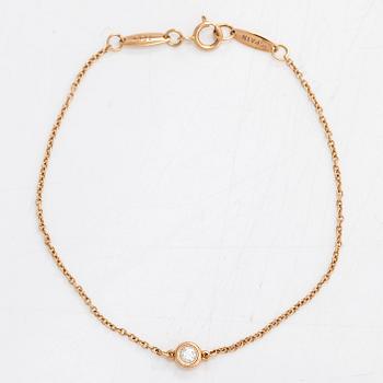 Tiffany & Co, Elsa Peretti, armband, 18K guld med en briljantslipad diamant   ca 0.07 ct.