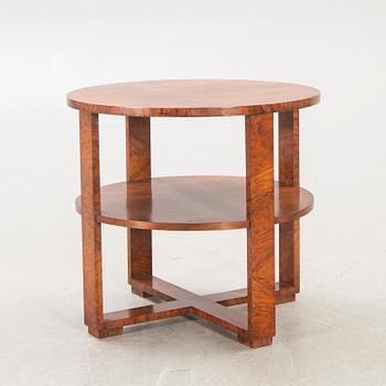 A mid 1900s walnut Art Deco table.